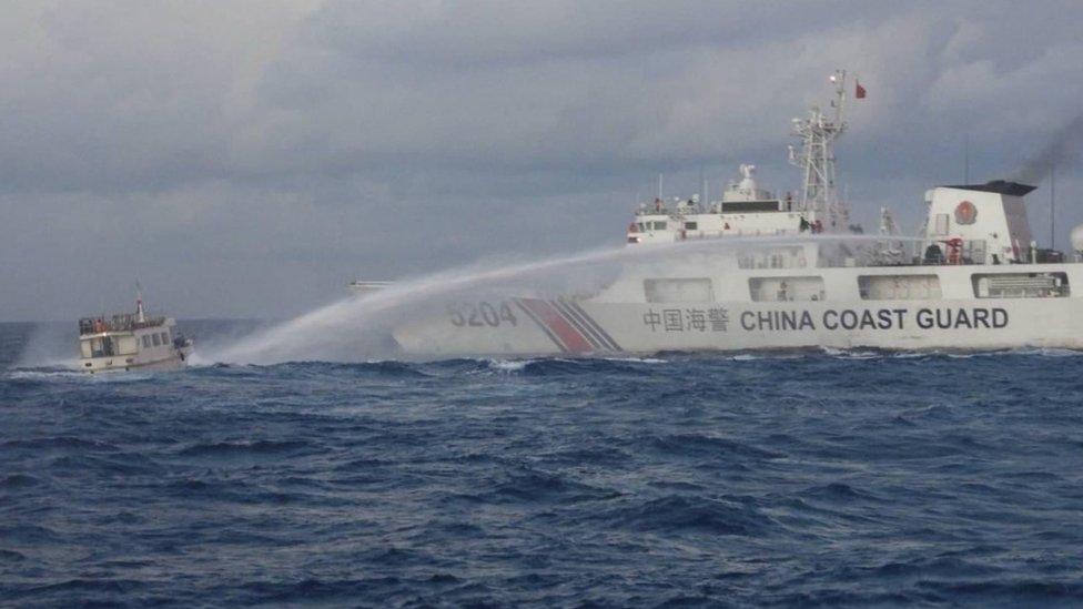 Chinese coast guard vessel firing water cannon at a Philippine government ship near Scarborough Shoal in the South China Sea, July 2026