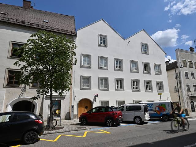 White building facade with Police sign on Adolf Hitler's former birthplace in Braunau am Inn Austria now converted to police station