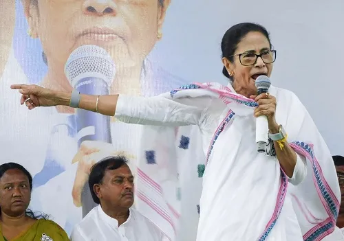 Mamata Banerjee addressing rally in Malda, alleging BJP interference and warning voters before elections.