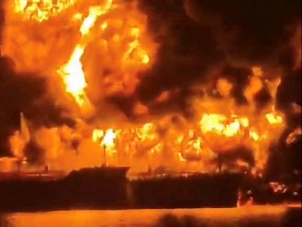 Two oil tankers engulfed in flames in Iraqi waters near Basra following Iranian strikes during the escalating US-Israel-Iran conflict.