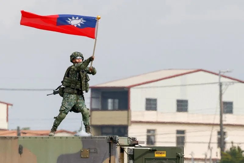 Taiwanese military personnel during Han Kuang annual war games exercise testing wartime weapons production relocation and civilian factory conversion August 2026