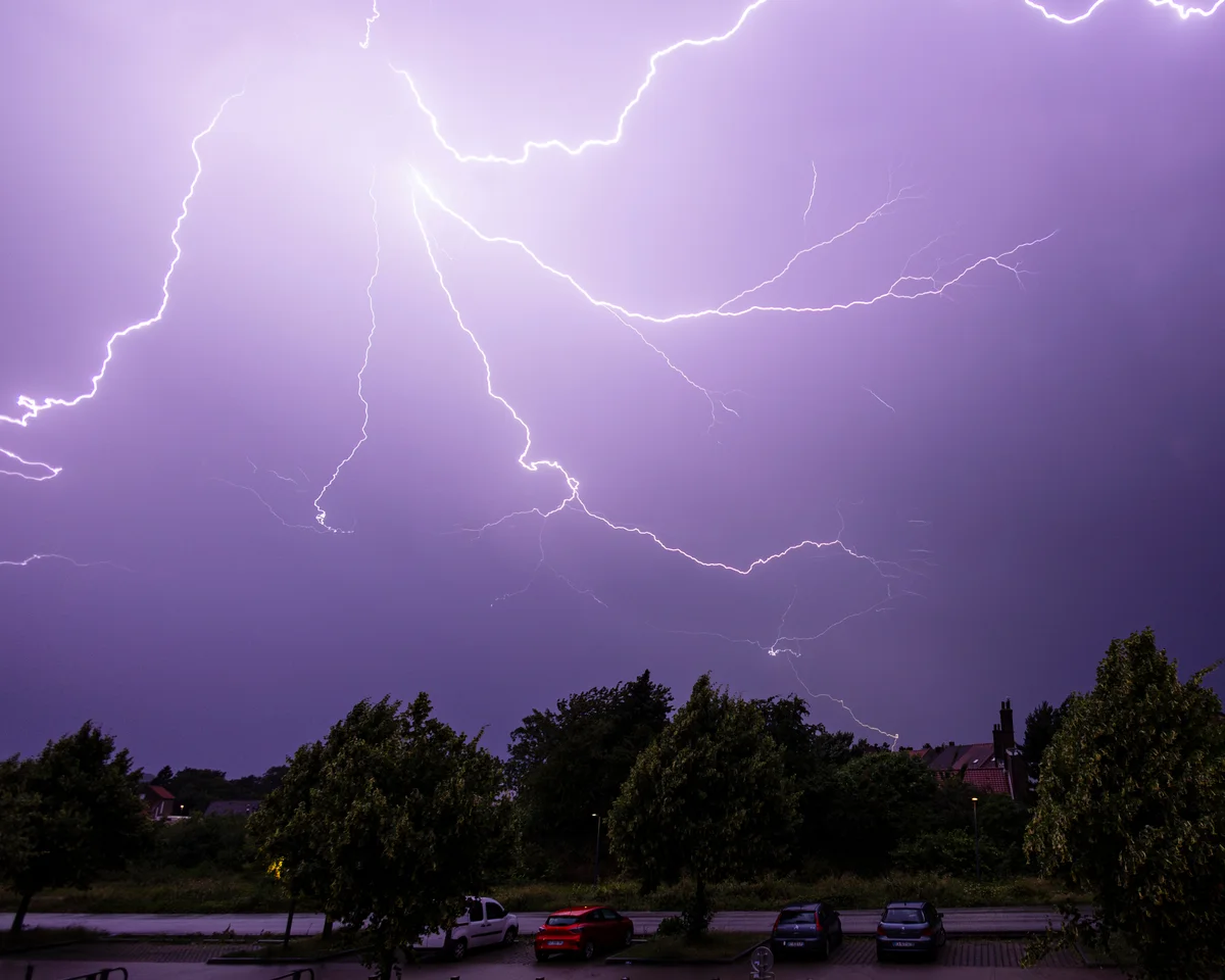 Storm damage in France with fallen trees, damaged power lines, and emergency crews restoring electricity after storms.