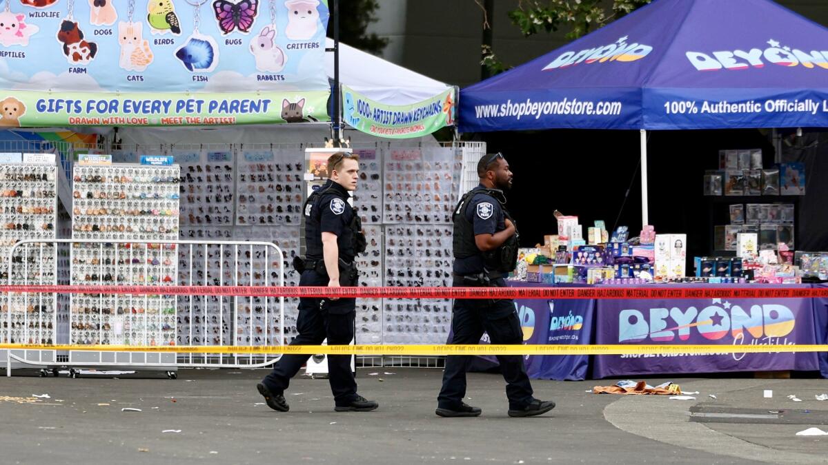 Seattle Center and Space Needle with emergency response vehicles outside following the Bite of Seattle shooting on July 25, 2026