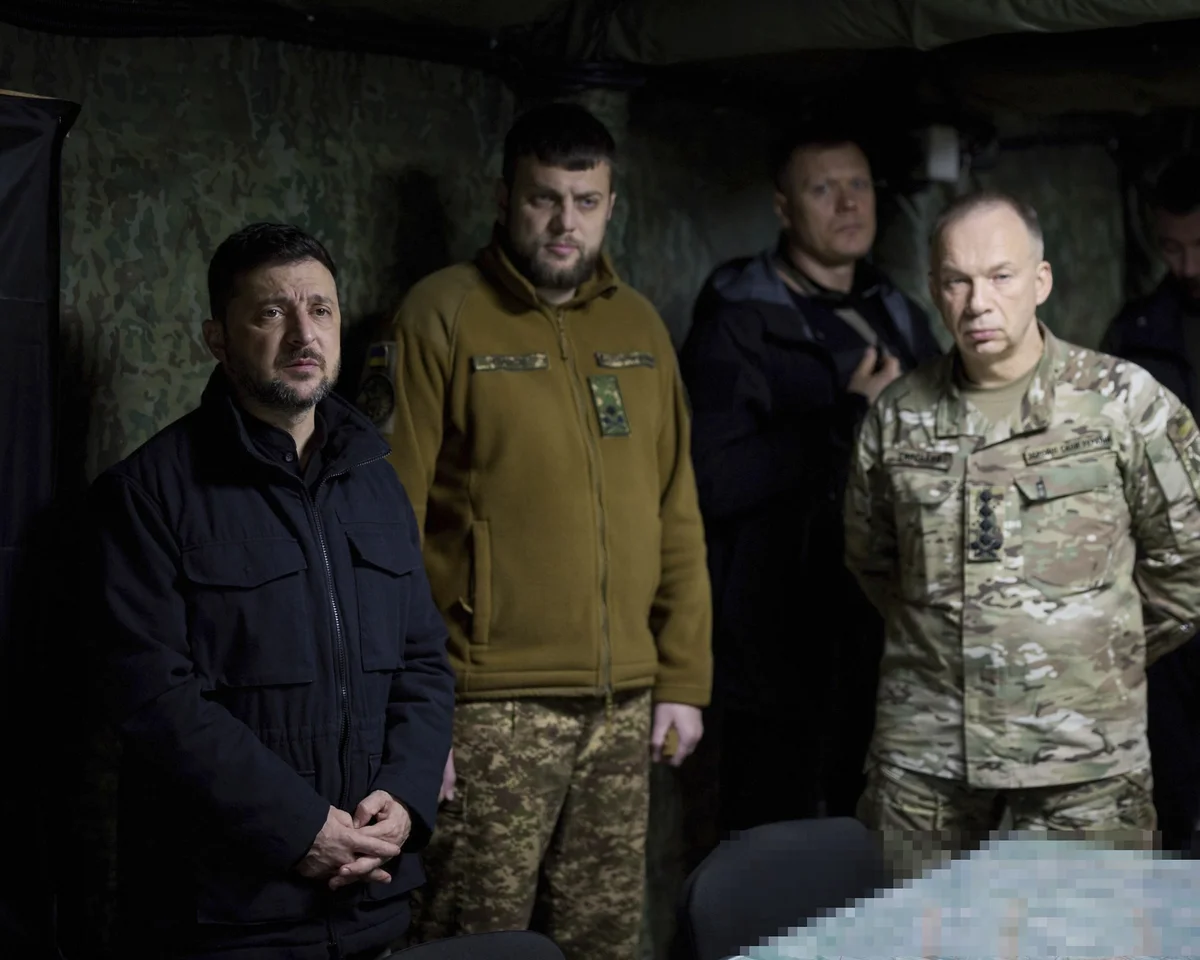 Ukrainian soldiers and military vehicles positioned near the frontline amid ongoing war tensions.